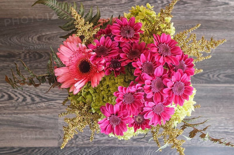 Bouquet of gerbera and chrysanthemum on a wooden background. floristic composition