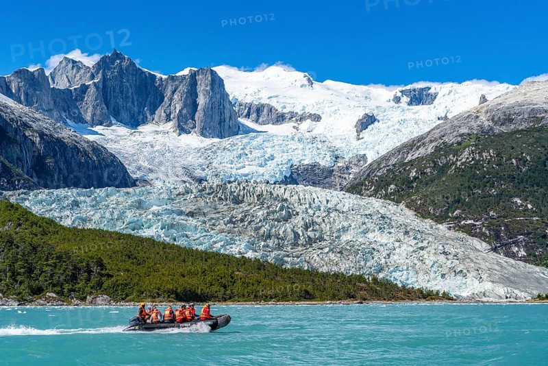 Passengers of the cruise ship Stella Australis travelling in a rubber dinghy in front of the Pia Glacier, Alberto de Agostini National Park, Avenue of the Glaciers, Chilean Arctic, Patagonia, Chile, South America