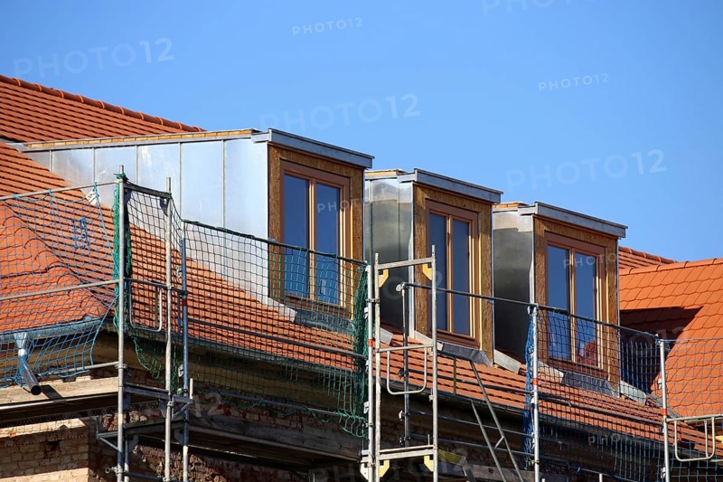 Roofer working on a new dormer window