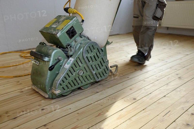 A parquet floor is sanded and oiled