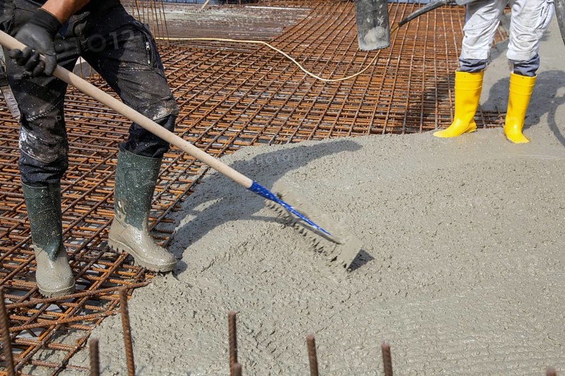 Delivery of ready-mixed concrete to the construction site of a residential building in a new development area in Mutterstadt, Palatinate
