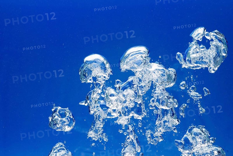 Bright Air bubbles, blue background in an aquarium