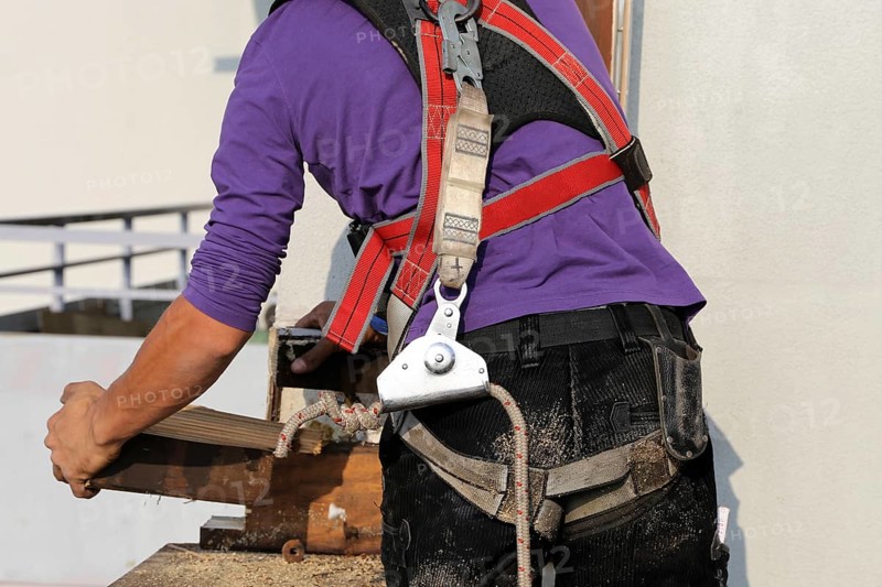 Roofer with fall protection