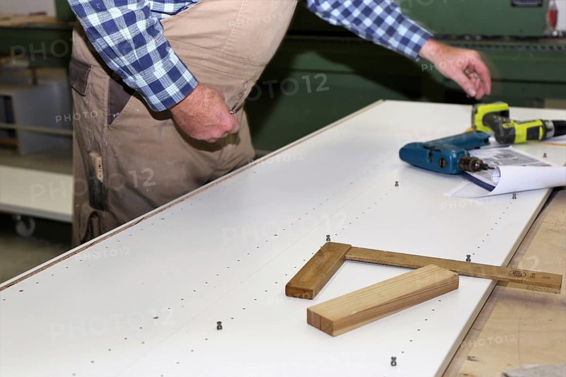 Carpenter at work in his carpentry workshop