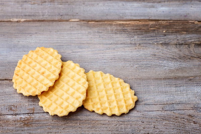 Sweet waffle on a rustic wooden background with copy space
