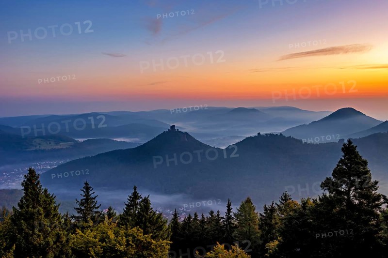 Trifels Castle in the Palatinate Forest in the morning mist at sunrise