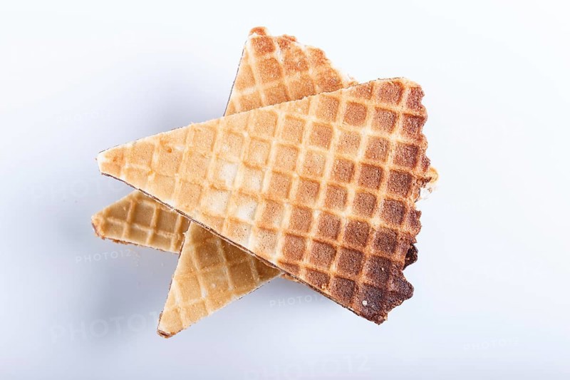 Waffle sandwiches with boiled condensed milk isolated on white background. closeup. top view