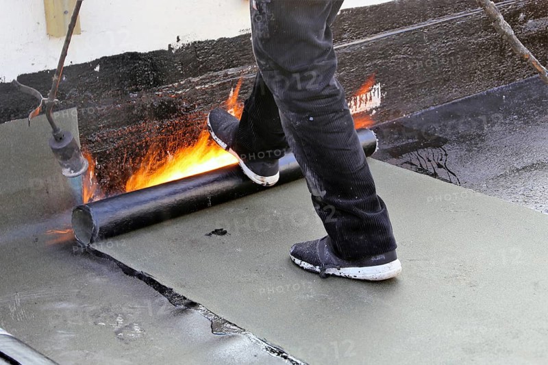Professional flat roof waterproofing with bitumen welding membranes