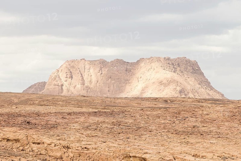 Desert, red mountains, rocks and cloudy sky. Egypt, color canyon, the Sinai Peninsula, Dahab