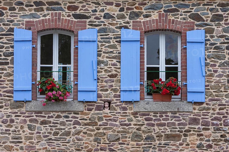Two windows in a granite house, blue shutters, floral decoration, Pontrieux, Departement Cotes dArmor, Brittany, France, Europe