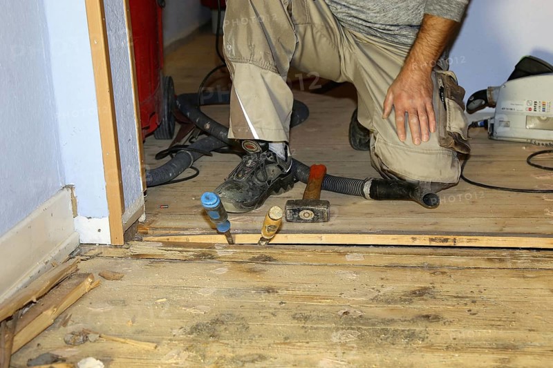 A parquet floor is sanded and oiled