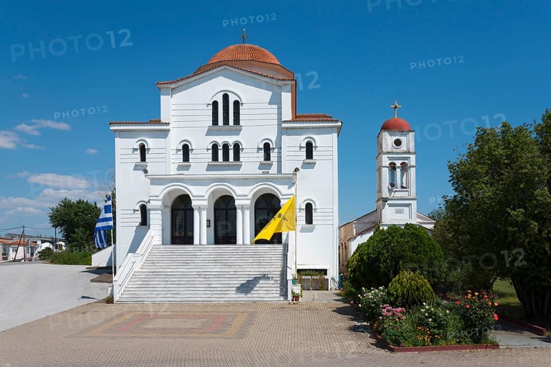 An imposing whitewashed church with a red roof and bell tower on a sunny day, Greek Orthodox Church of the Transfiguration of the Saviour, Porto Lagos, Xanthi, Eastern Macedonia and Thrace, Greece, Europe