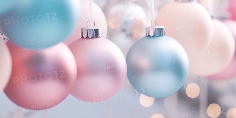 Pastel colored Christmas tree baubles on white strings. KI generiert, generiert AI generated