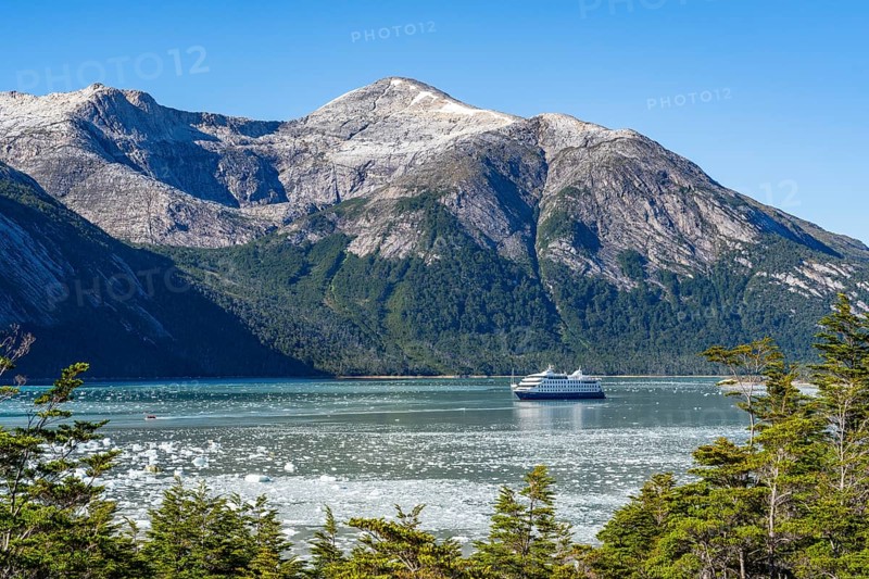 Cruise ship Stella Australis anchored between ice floes in Pia Bay in front of the Pia Glacier, Alberto de Agostini National Park, Avenue of the Glaciers, Chilean Arctic, Patagonia, Chile, South America