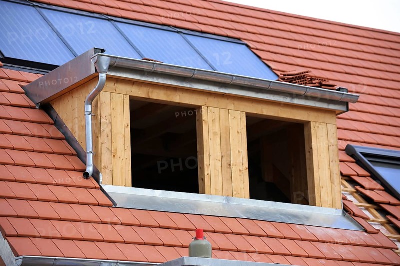 Roofer working on a new dormer window
