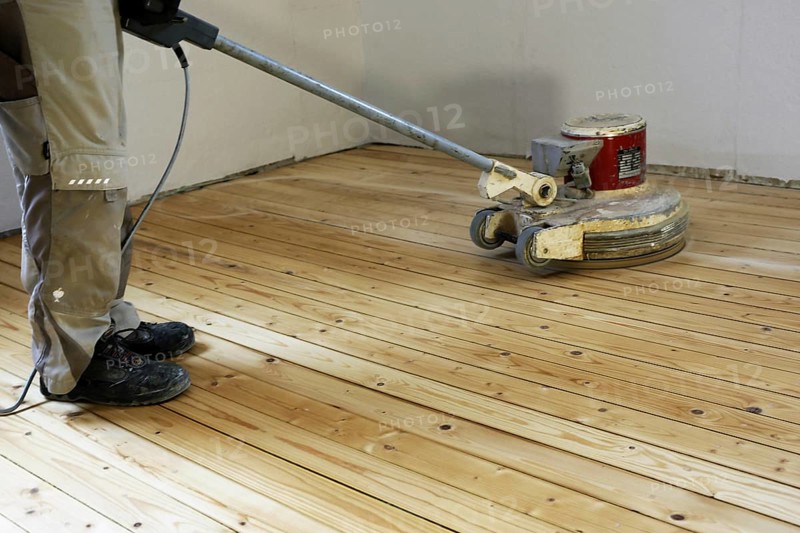 A parquet floor is sanded and oiled