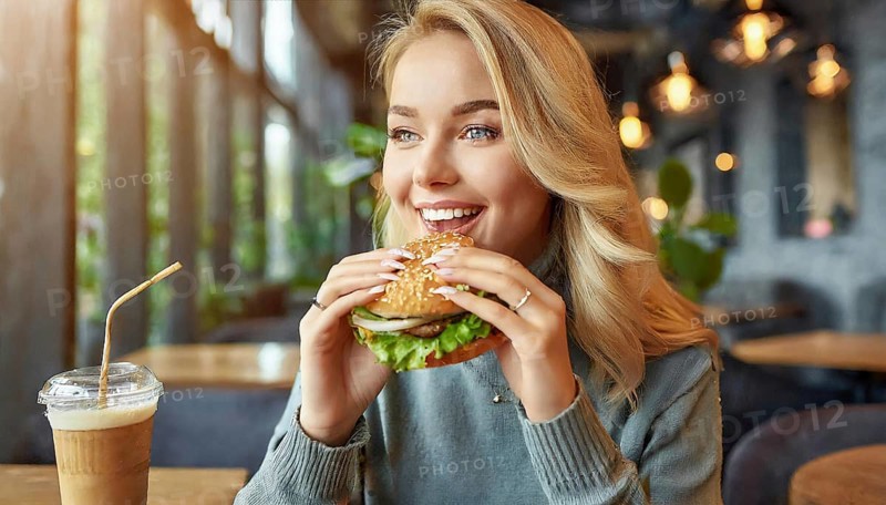 AI generated, human, humans, person, persons, woman, woman, 25, years, sits in restaurant, a person, seasons, eats, eating, burger, hamburger, snack bar