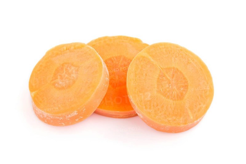 Carrot slices isolated on white background. top view, flat lay, close up, macro