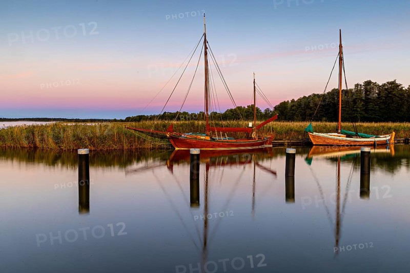 Old sailing boats in the harbour of Wieck on the Darss in the morning light