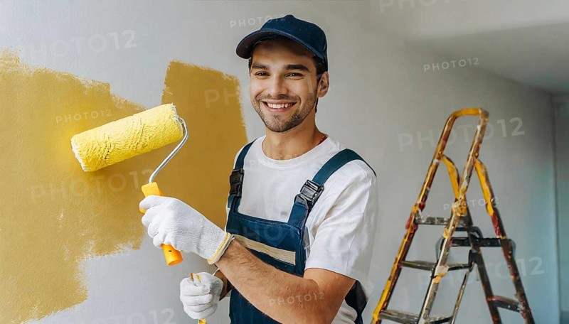 AI generated, man, men, a painter paints a wall with new yellow paint, father, renovation of old flat, paint roller, ladder, yellow, paint, 25, 30, years, a, person, occupation, occupations, leisure activity, family, smiles, smiling, fun at work, laughing, laughing, laughing, friend, partner, man