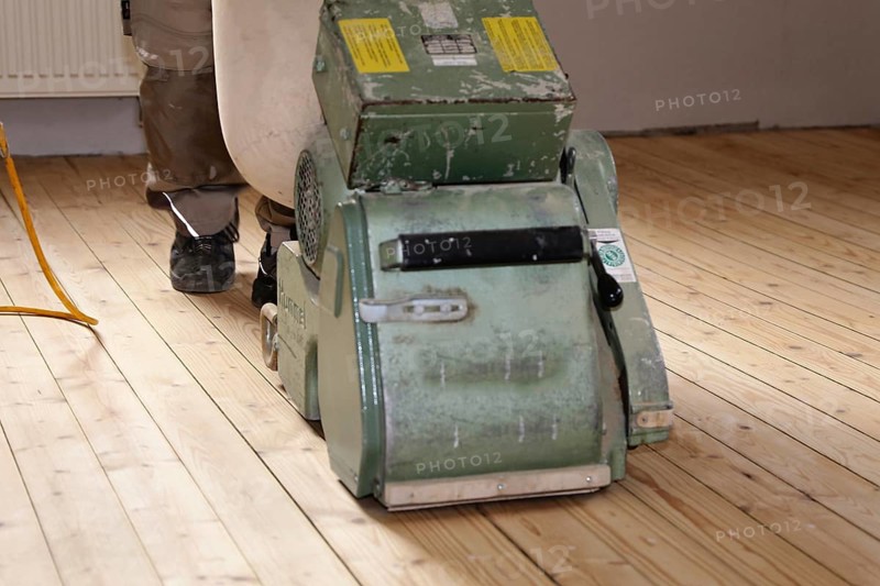 A parquet floor is sanded and oiled
