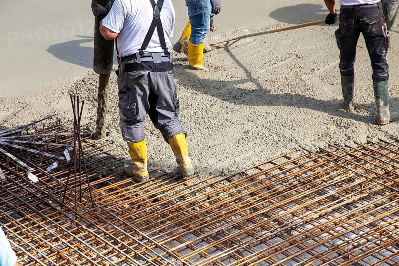 Delivery of ready-mixed concrete to the construction site of a residential building in a new development area in Mutterstadt, Palatinate