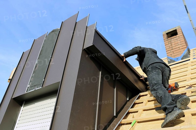 Roofer working on a new dormer window
