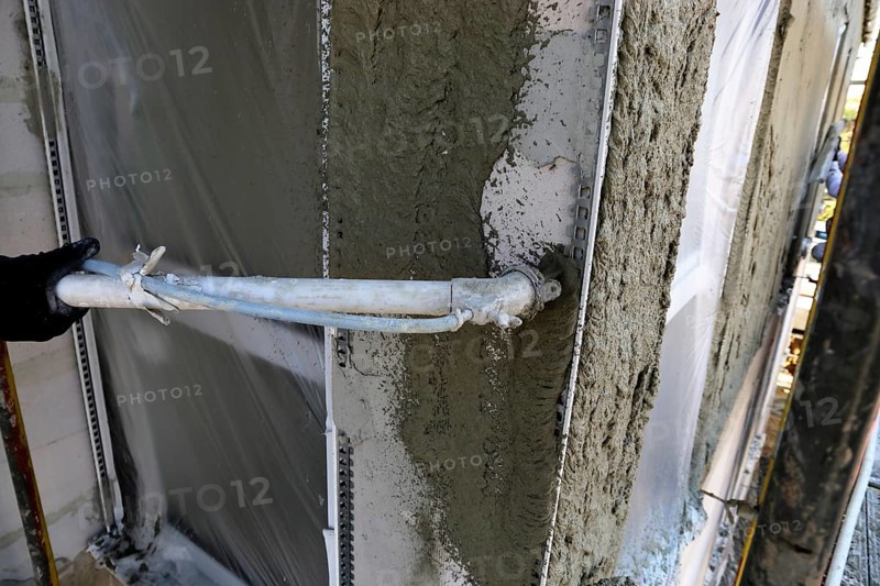 Plasterer plastering an exterior wall