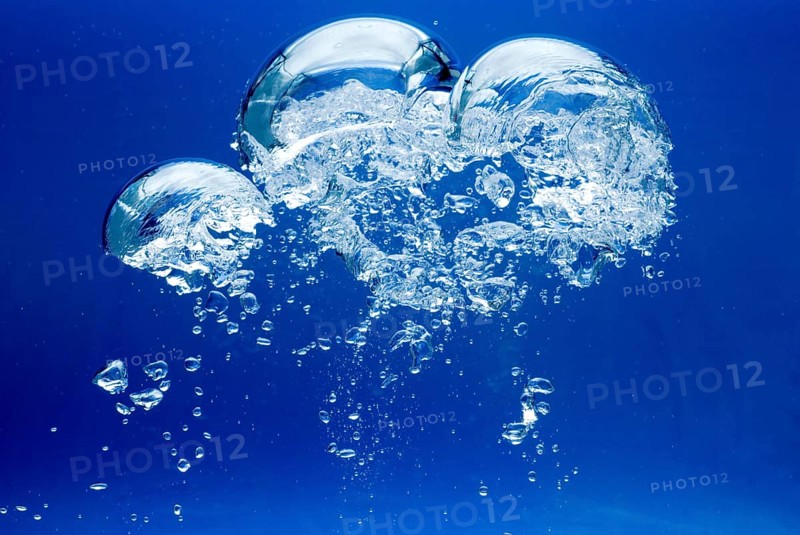 Bright Air bubbles, blue background in an aquarium