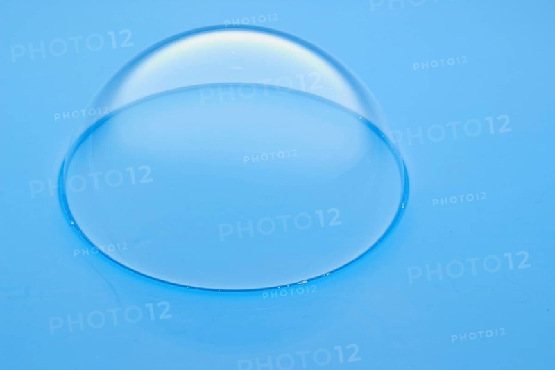 A large soap bubble on light blue water