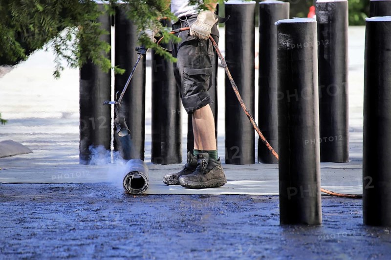 Professional flat roof waterproofing with bitumen welding membranes