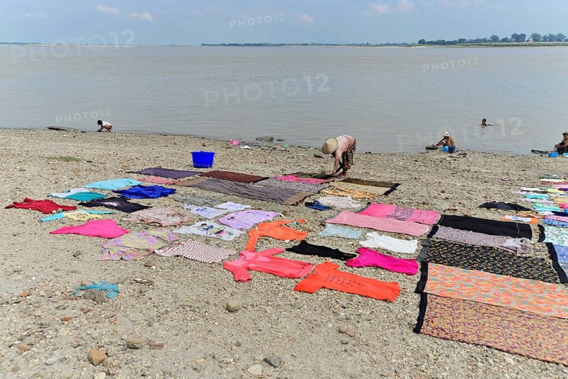 Washing clothes in the Irrawaddy, Myanmar, Asia