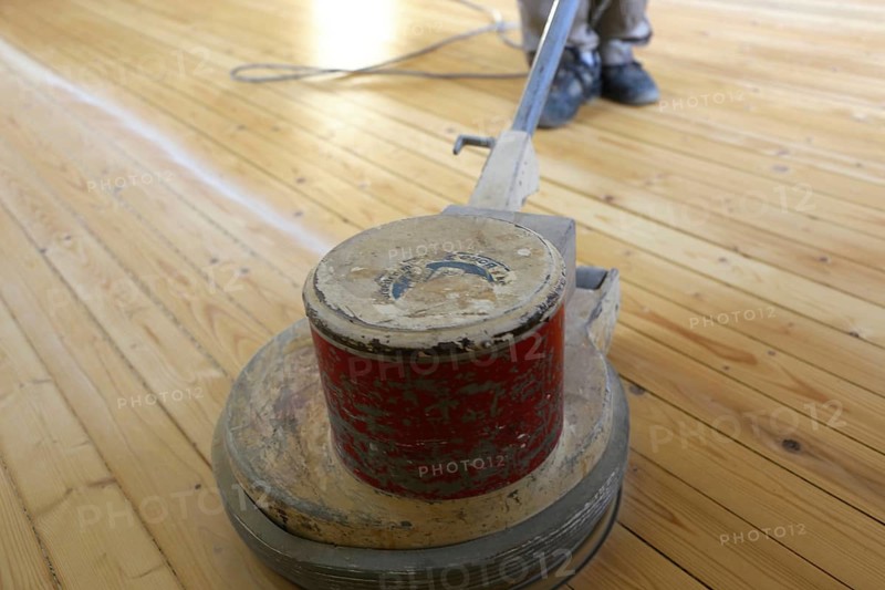 A parquet floor is sanded and oiled