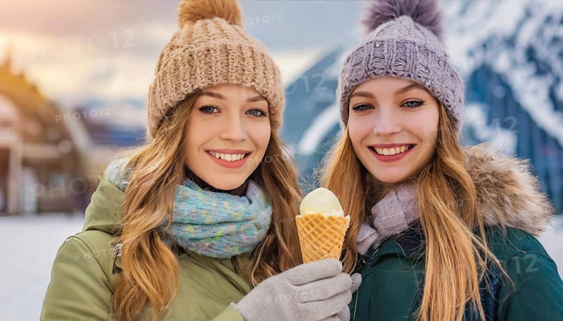 AI generated, human, humans, person, persons, woman, woman, child, 20, 25, years, two persons, outdoor, ice, snow, winter, seasons, eats, eating, waffle ice cream, waffle, Italian ice cream, cap, bobble hat, gloves, winter jacket, cold, coldness