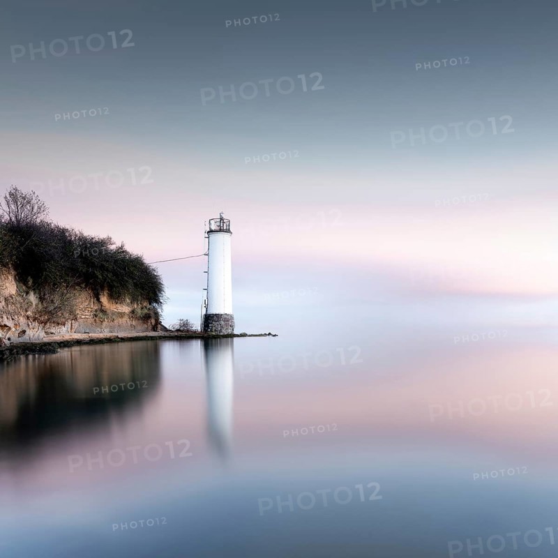 The Maltzien lighthouse stands at the foot of a small cliff at the southern tip of the Zudar peninsula on the island of Ruegen