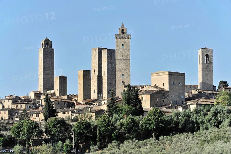 Town view, town scape, cityscape of San Gimignano in autumn, gender towers, countryside, in fall, fields of olive trees, wineyards, Tuscany, Italy, Europe