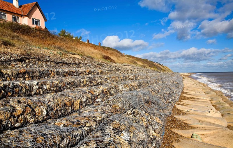Coastal defences normally covered by shingle exposed by winter storms at Thorpeness, Suffolk, England in November 2013