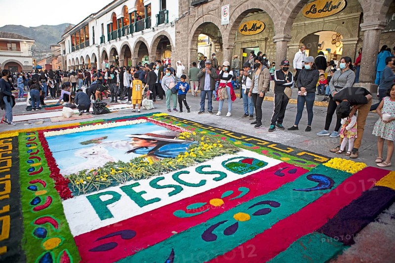 Peruvian people look at a floor painting in the Plaza de Armas, Ayacucho, Huamanga province, Peru, South America