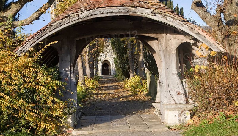 Historic wooden lychgate entrance to St Mary church, Kelsale, Suffolk England