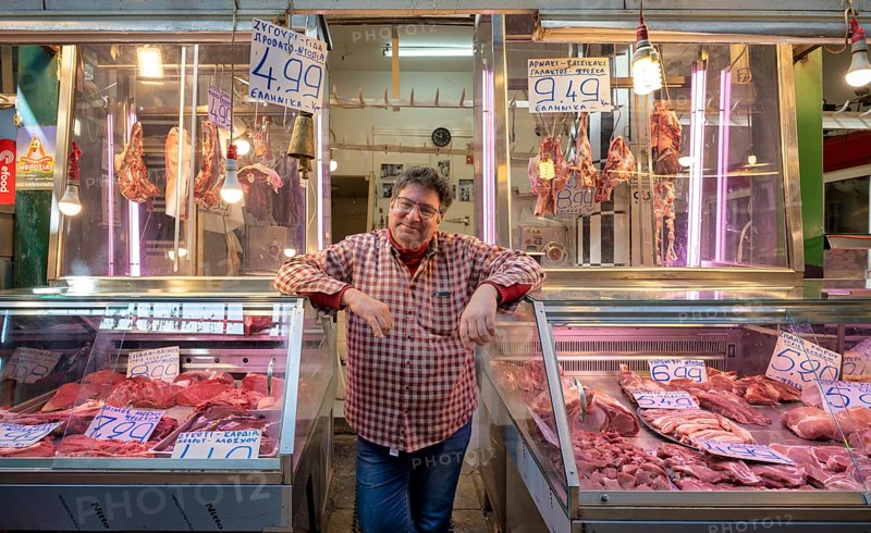 Butcher, meat trader posing proudly in front of his market stall, display of fresh meat, butchery, food, Kapani market, Vlali, Thessaloniki, Macedonia, Greece, Europe