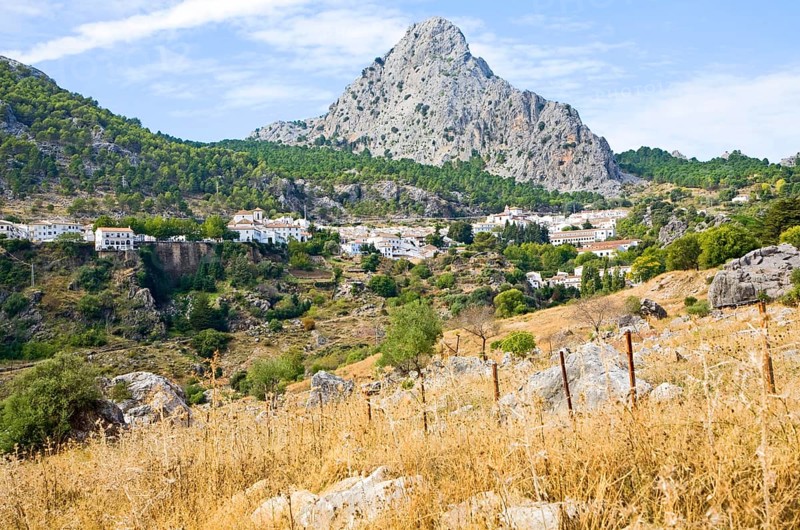 Limestone mountain peaks tower over the Village of Grazalema, Cadiz province, Spain, Europe