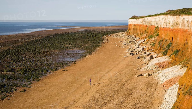 Chalk, red chalk and carstone form striped cliffs of white, red and orange at Hunstanton, Norfolk, England, United Kingdom, Europe