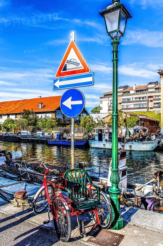 Self-built wheelchair, in the harbour, island of the lagoon town of Grado, northern Adriatic coast, Friuli, Italy, Grado, Friuli, Italy, Europe