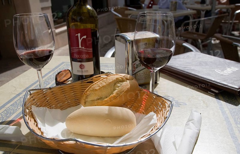 Wine and bread on restaurant table in Ronda, Spain, Europe