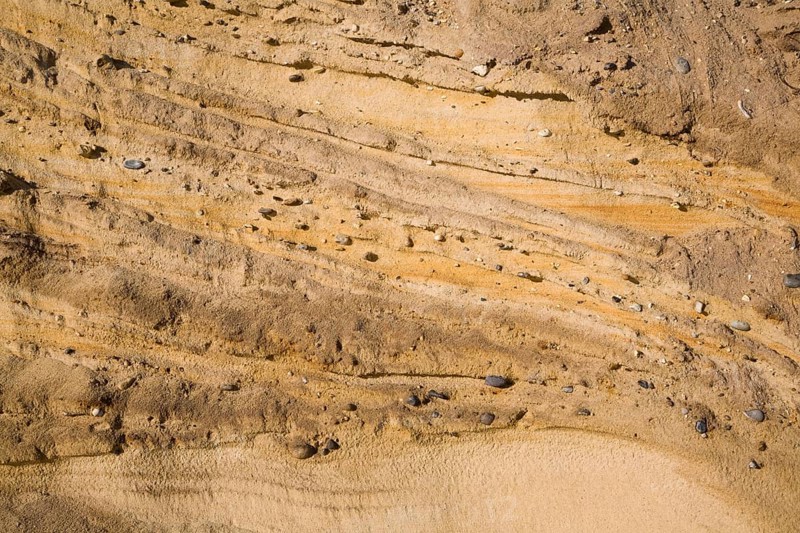 Pleistocene ice age outwash deposits in sedimentary Red Crag rock strata of cliff face, Suffolk coast, Benacre, England, United Kingdom, Europe