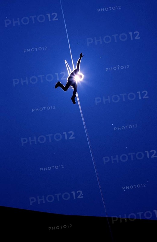 Man after jumping from Gemstalbruecke near Tannheim, Tyrol, Austria, vintage, retro, Europe