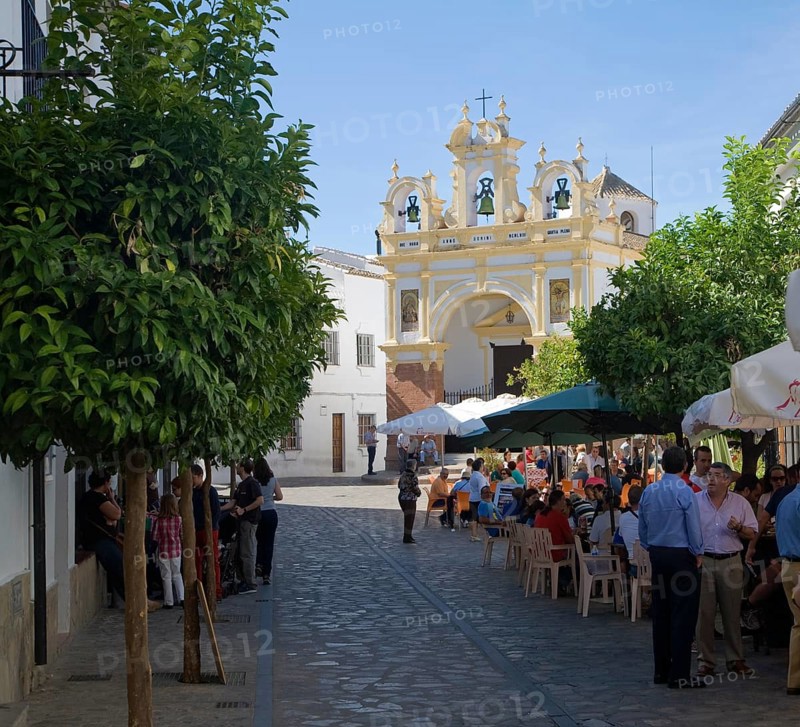People gather in cafes and by the baroque church of San Juan at Zahara de la Sierra, Spain Sunday 13 October 2013 after the National Day holiday