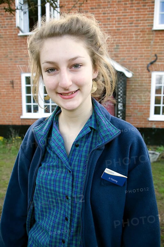 Model released teenage girl in uniform for her job in a Co-operative shop, UK