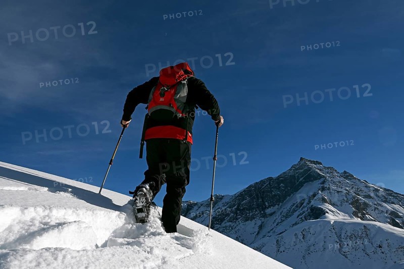 Snowshoe hiking in the Beverin nature park Park, Graubuenden, Switzerland, Europe