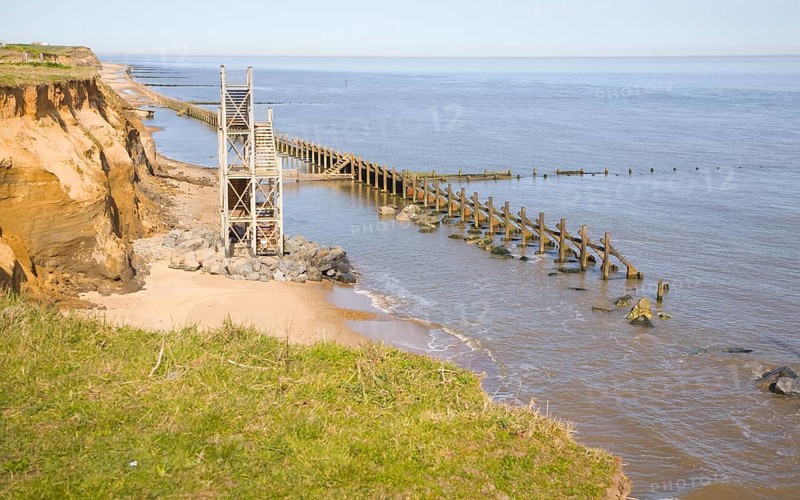 Former beach access stairs and old sea defences at Happisburgh, Norfolk, England, United Kingdom, Europe